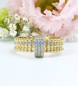 Złoty, nowy pierścionek z kuleczkami i cyrkoniami