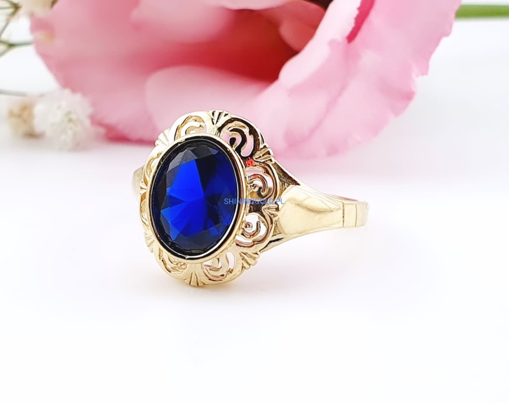 Złoty, nowy pierścionek z niebieskim kamieniem (079WS)