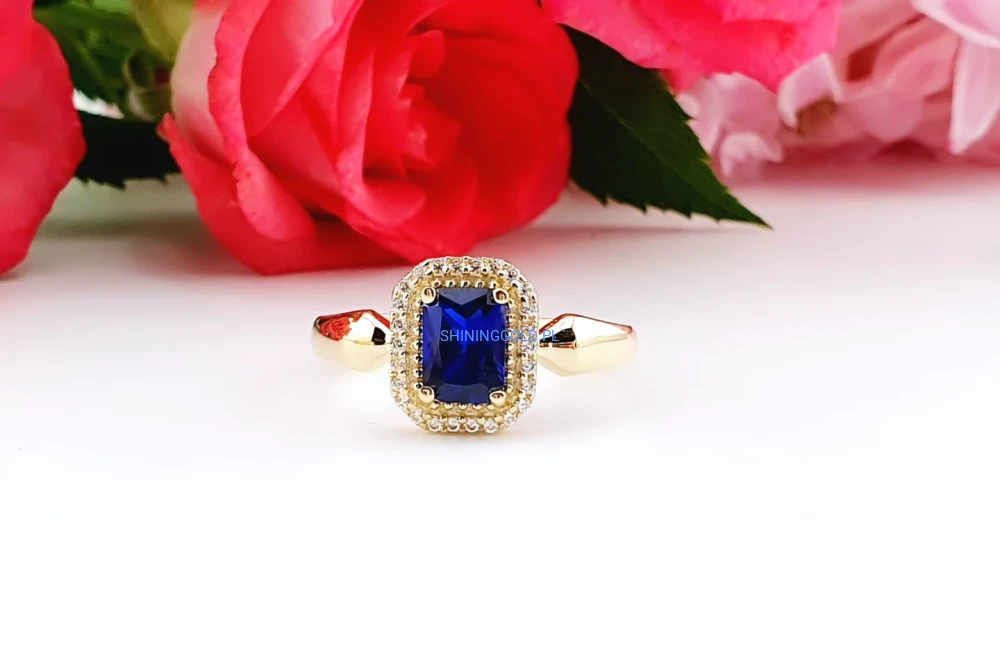 Złoty, nowy pierścionek z niebieskim kamieniem i cyrkoniami (024A)