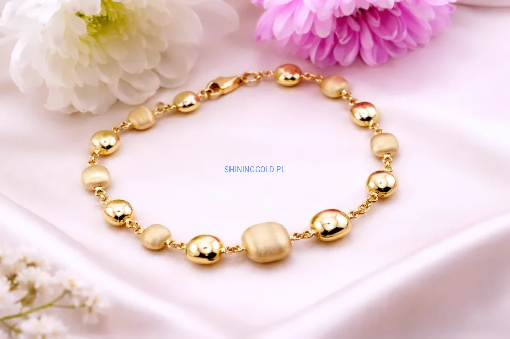 Złota bransoletka – kulki z satynowym wykończeniem (432A)